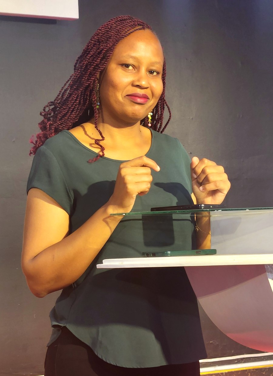 Linet Murugi speaking at a conference